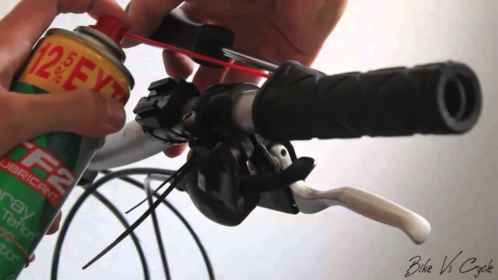 To successfully remove a slip-on mountain bike grip, lift it using a flat screwdriver, then spray a lubricant under the grip and twist it off.