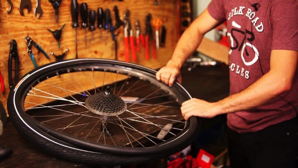 If the tube is not fitting into the tire easily deflate it a little bit.