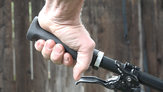 Point your thumb down to minimize strain on the wrist while biking