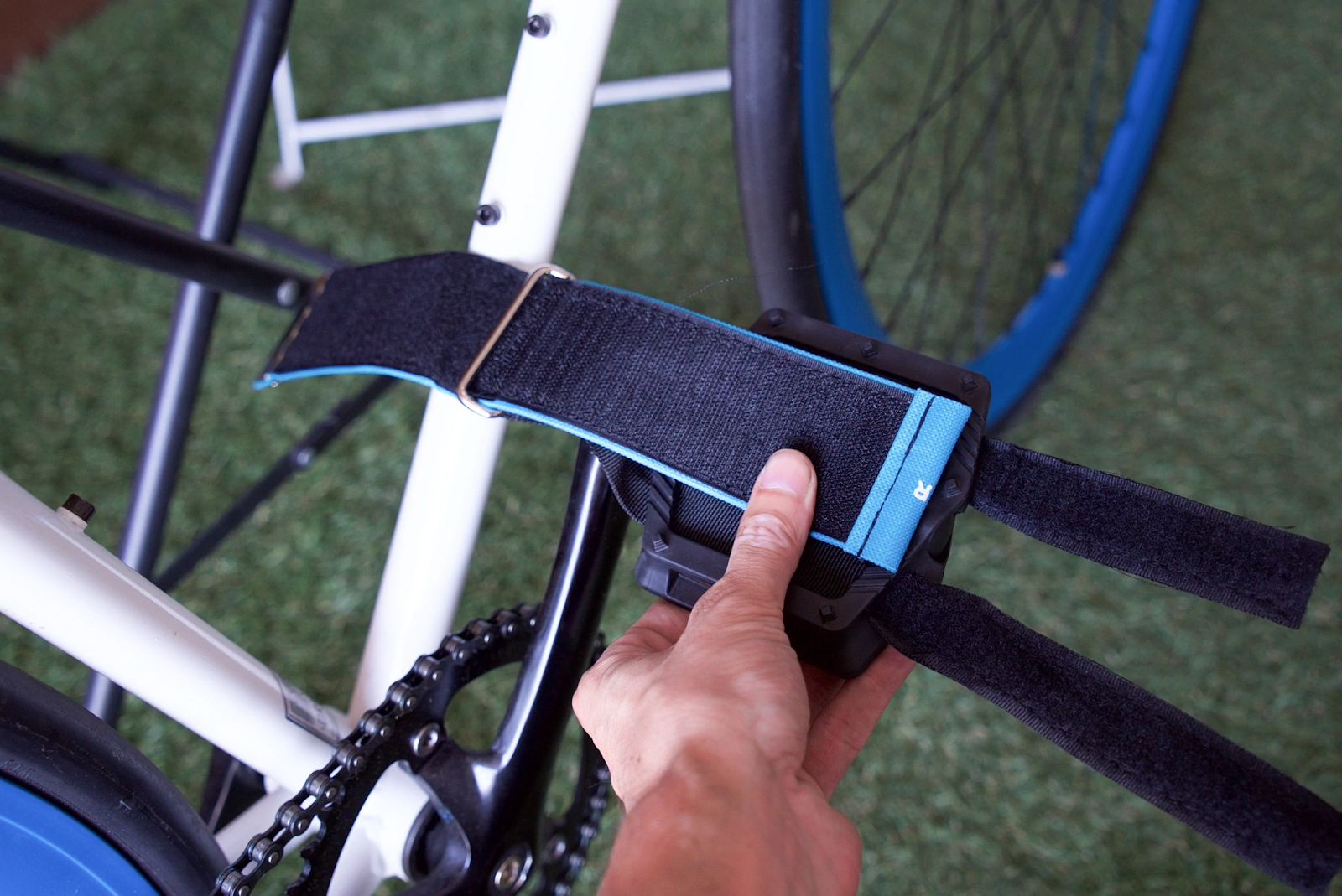 To install mountain bike pedal straps, the two straps of the bottom section should be threaded through the pedal and the top part of the pedal strap threaded through the metal clasp of the bottom half of the pedal clasp.  