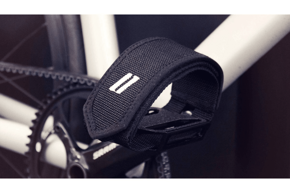 Fit each strap over each respective foot to make sure that they both have a snug fit, before setting off on your ride.