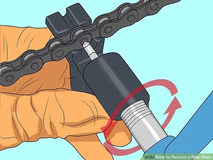 Remove the old chain by undoing the quick link or by removing a pin using a chain splitting tool.