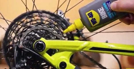 Apply a small amount of chain lube to the chain of your mountain bike to keep it moving smoothly without coming off.