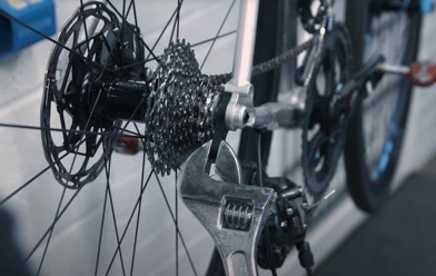 Using a wrench carefully manipulate the derailleur hanger back into its correct position.