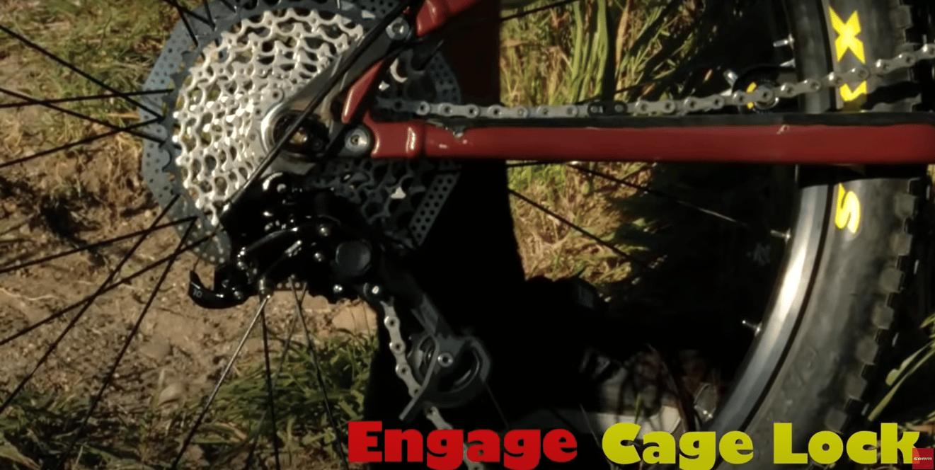 If your derailleur has a cage lock feature press the small lock button and push it into position.