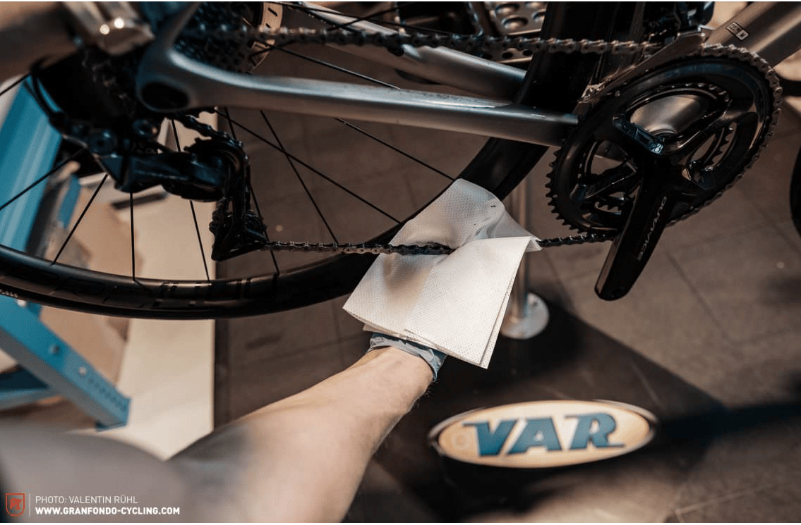 Use a lint-free cloth to wipe any excess lubricant from your mountain bike chain.