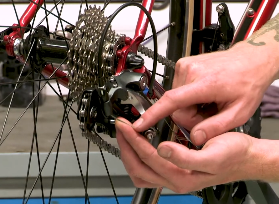 A stretched derailleur cable could be the reason for your mountain bike chain jumping gears.
