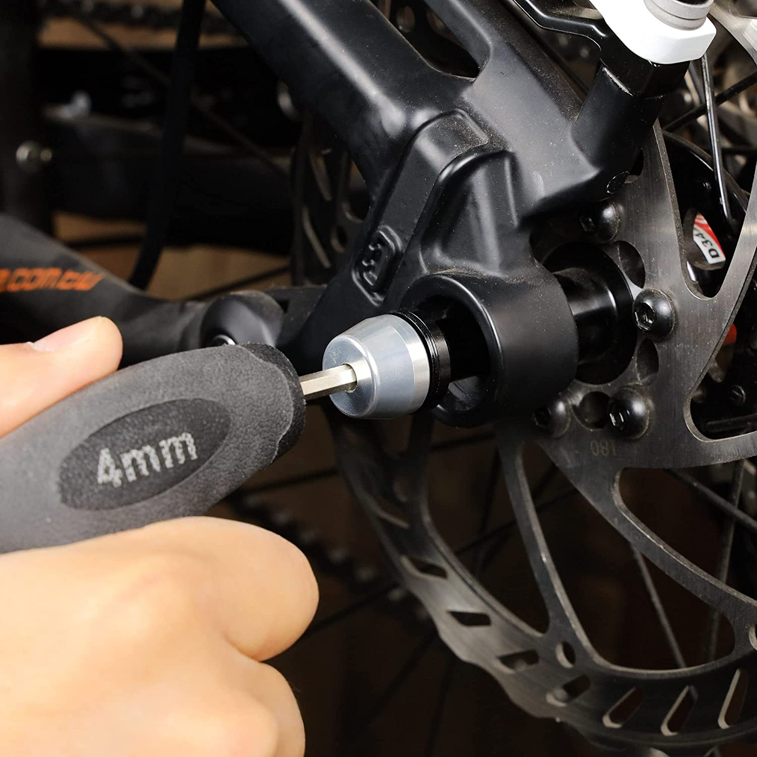To tighten your mountain bike chain you will have to loosen the rear wheel thru-axle using a rear wheel skewer.