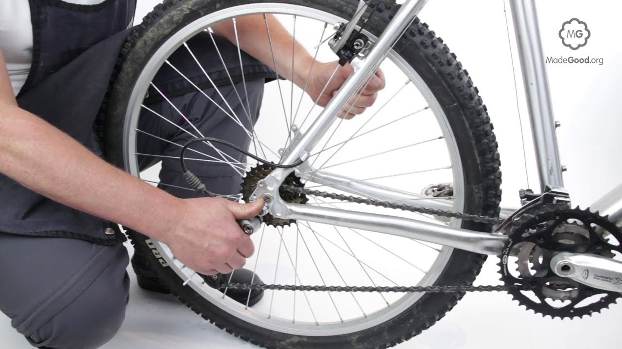 To tighten the chain on a mountain bike with a derailleur make small adjustments to the rear wheel so that you don’t tighten the chain too much. 