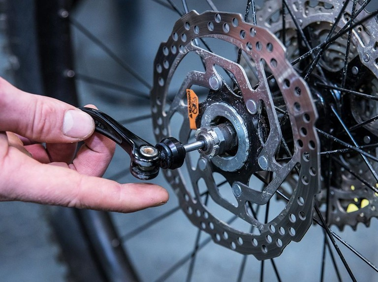 Make sure that your wheel is secured properly once you have positioned it and your chain is tight enough. 