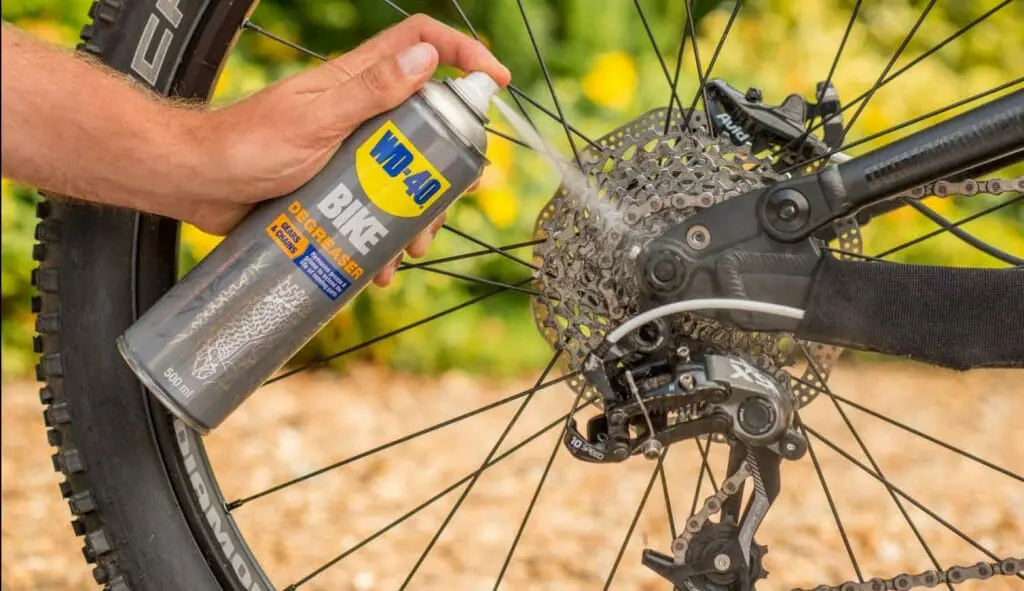 When using a degreaser to clean a mountain bike chain allow for it to stand so that it breaks down the grease and grime properly.  