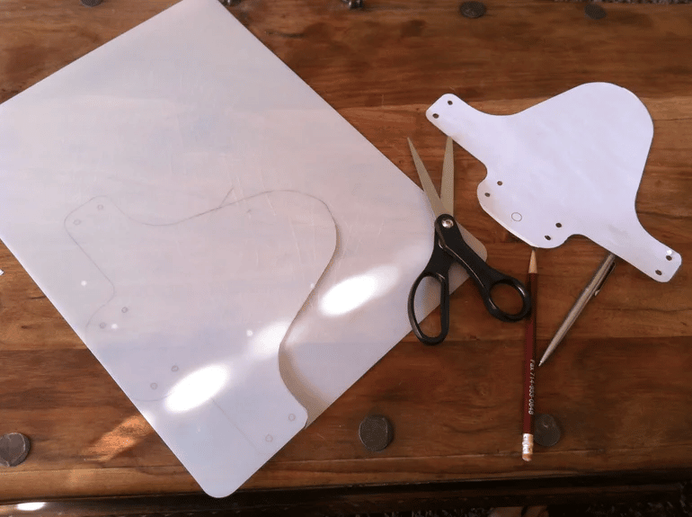 Cut the mudguard shape that you have traced onto the plastic out.