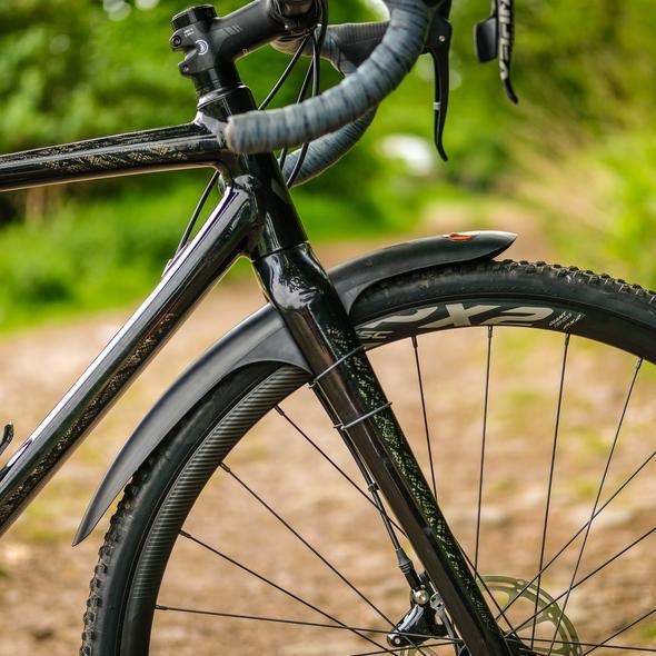 Choose wider clip-on bike fenders for mountain bikes to fit onto a gravel bike as the tires on these bikes are wider. 