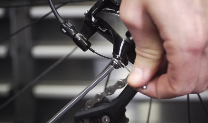 Tighten the derailleur bable to see if that solves the problem.