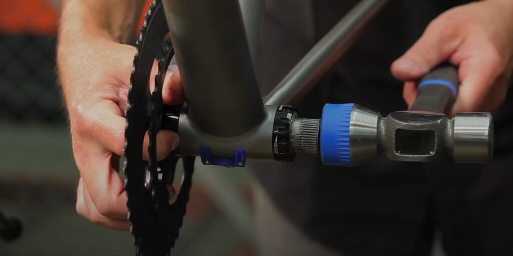 If the crank doesn’t want to come loose use a rubber mallet to gently tap the axle and crank out. 