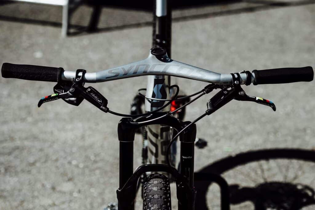 If you have long arms then you would need more cockpit space which means that you would need a mountain bike with a greater reach.