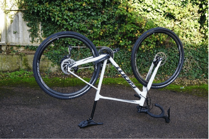Turn your mountain bike upside doen to balance on the handlebar and seat, so that you can work on the drivetrain.
