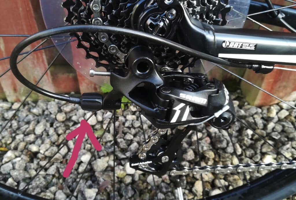 To fix a mountain bike chain that keeps jumping, tweak the barrel adjuster.