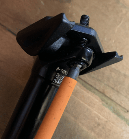 To repair a mountain bike seat dropper with a sticky lever, undo the seat clamp.