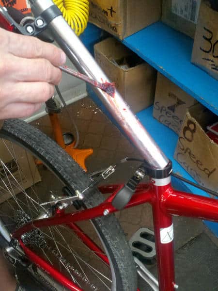 Apply grease to the seat post using a small soft brush.