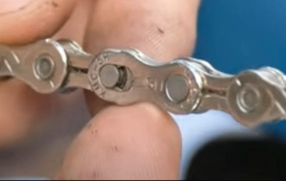 Locate the master link to remove the chain from your mountain bike.
