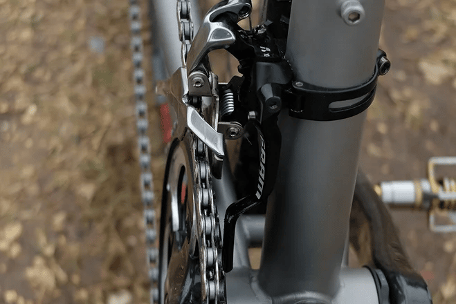 To stop the bike chain from rubbing against the front derailleur due to cross chaining simply switch the gears of your bike to realign the chain.