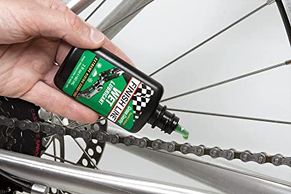 What makes chain lube easier to use vs. mountain bike wax is that lube can just be dropped into the moving parts to penetrate all the components.