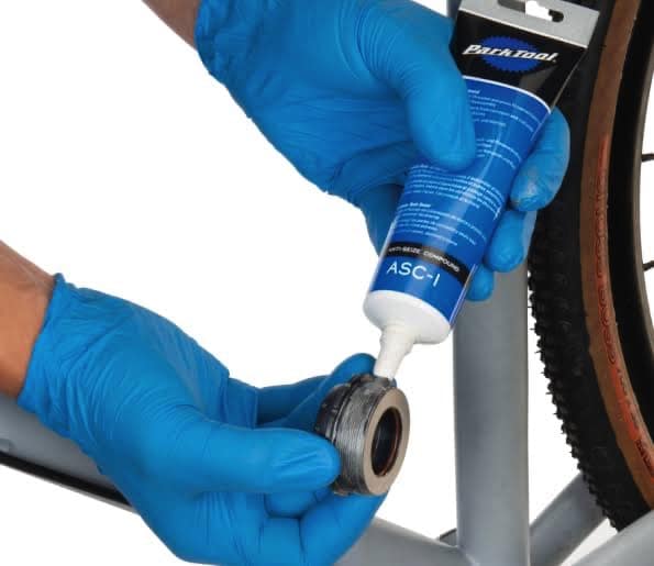 Apply grease to the handlebar components before installing them.